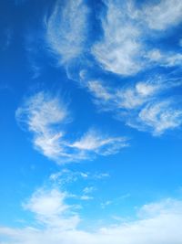 Low angle view of white clouds in blue sky