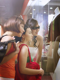 Friends doing shopping at mall