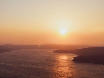 Drone sunset view of sydney harbour, australia. the air is full of haze and smoke from bushfires