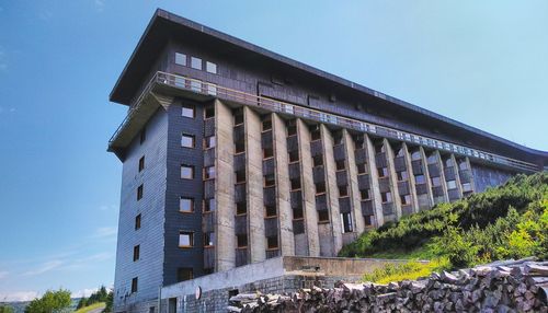 Low angle view of historical building against blue sky