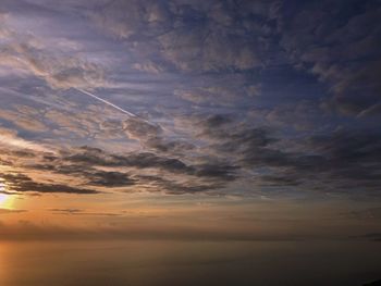 Low angle view of dramatic sky during sunset