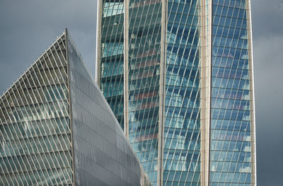 Low angle view of modern buildings against sky