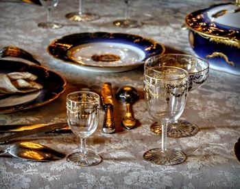 Close-up of wine glasses on table