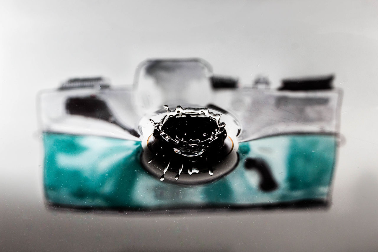 jewellery, fashion accessory, blue, indoors, gemstone, black, close-up, green, no people, studio shot, glass, ring, white