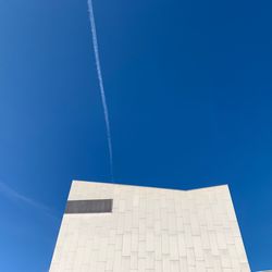 Low angle view of building against clear blue sky