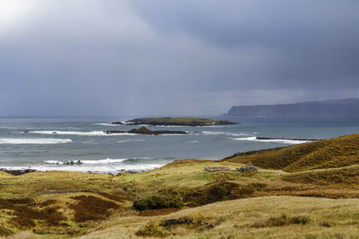 Scenic view of beach against sky