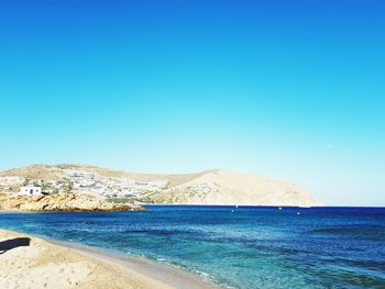 Scenic view of sea against clear blue sky