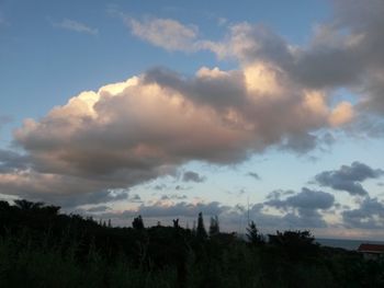 Scenic view of landscape against cloudy sky