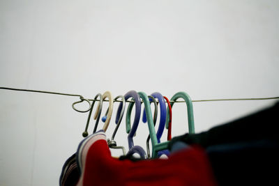 Close-up of clothespins on clothesline