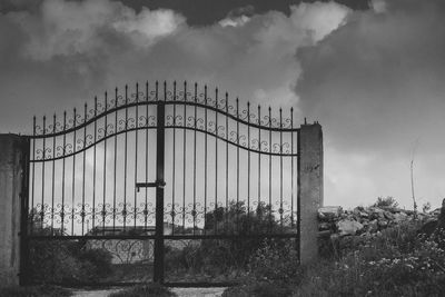 View of bridge against cloudy sky