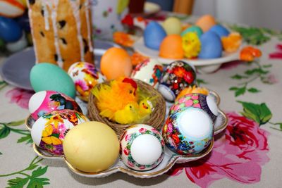 Painted easter eggs in tray on table