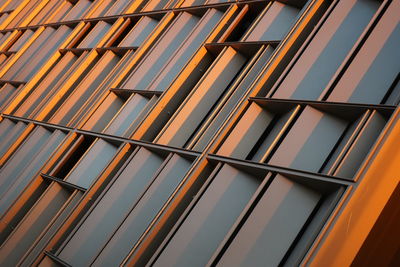 Closeup focus view of copper color building facade detail, abstract. taken at sunset twilight. 
