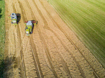 High angle view of tractors in field