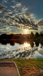 Scenic view of lake at sunset