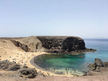 Rocky beach and clear blue sea