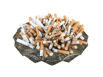 Close-up of cigarette against white background