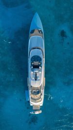 Aerial view of boat moored in frozen sea