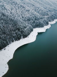 High angle view of river by snow during winter