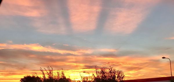 Low angle view of dramatic sky during sunset