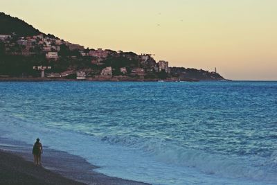 Scenic view of beach at sunset