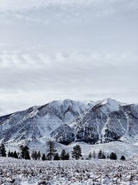 Scenic view of snowcapped mountains against sky