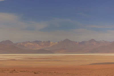 Scenic view of desert against sky during sunset