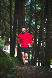 Full length of man running in forest