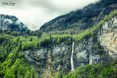 Scenic view of landscape and mountains against sky