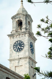 Low angle view of clock tower against sky