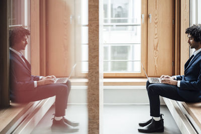 People sitting in front of building