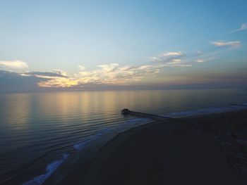 Scenic view of sea against sky at sunset