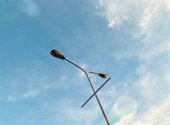 Low angle view of street light against sky