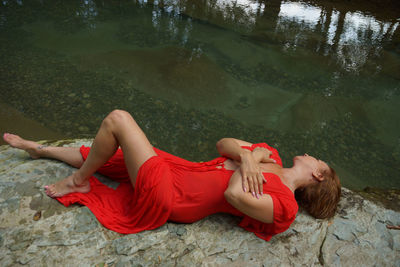 Woman lying on a lake