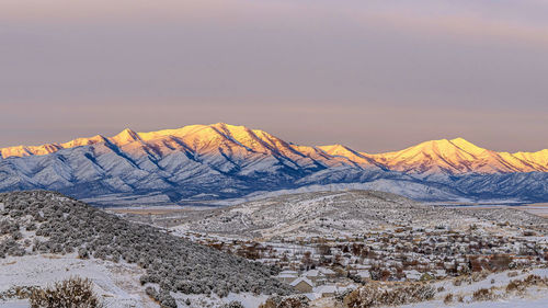 Scenic view of snowcapped mountains against sky during winter