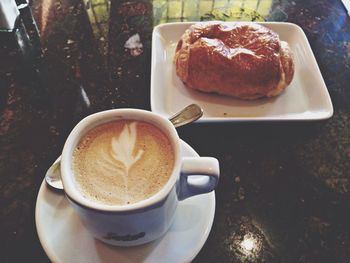 Close-up of cappuccino on table