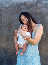 Woman and baby asian and nationality thai is happy feel