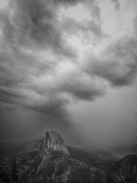 Scenic view of landscape against cloudy sky