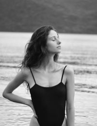 Woman looking away at beach 