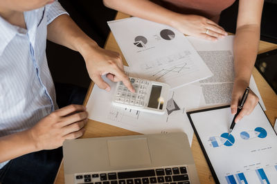 Low section of people working on table