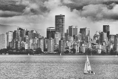 City skyline against cloudy sky