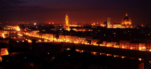 High angle view of illuminated buildings in city at night