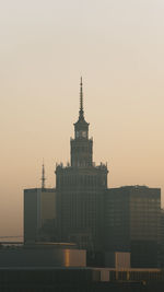 Low angle view of city at sunset