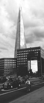 View of modern building against cloudy sky