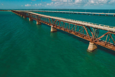 Pier over sea against sky