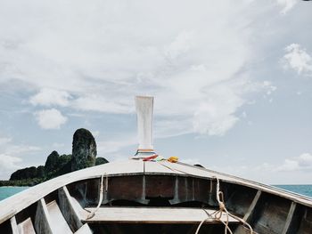 Ship moored on sea against sky