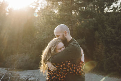 Couple hugging together