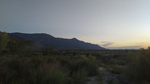 Scenic view of landscape against sky during sunset