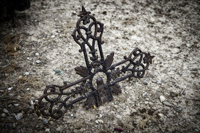 High angle view of rusty metal on field