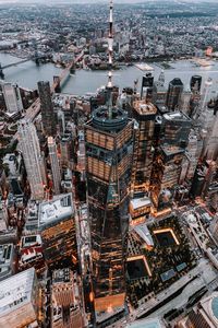 High angle view of illuminated one world trade center in city during sunset