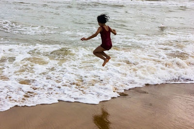 Full length of boy on beach